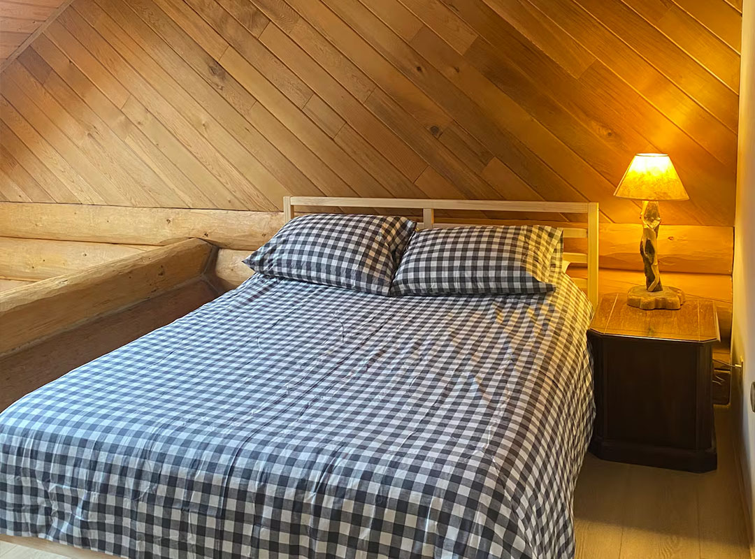 Airbnb photography before photo of cabin bedroom in Okanagan at Mount Baldy