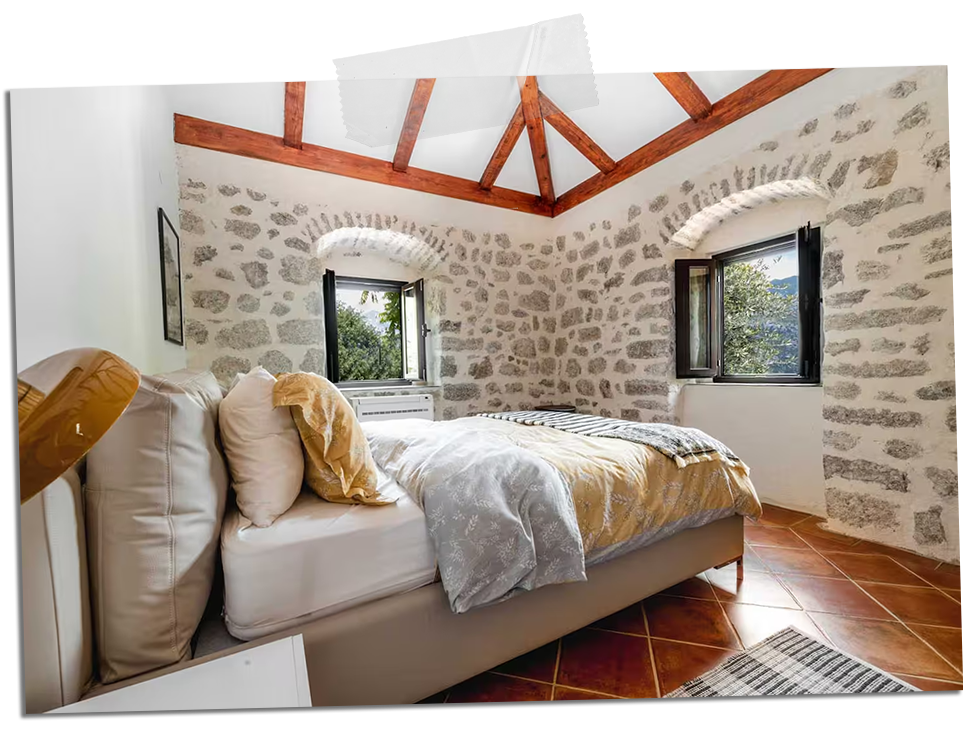 Vacation rental bedroom with cozy design and natural light in Kotor Bay, Montenegro